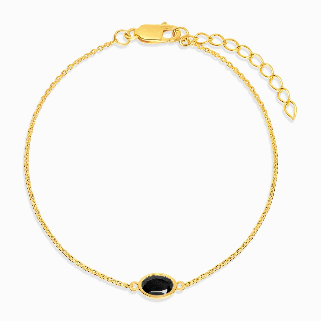 Pulsera con cristal negro Onyx en oro. Pulsera de piedras preciosas con piedra natal de julio de ónix.