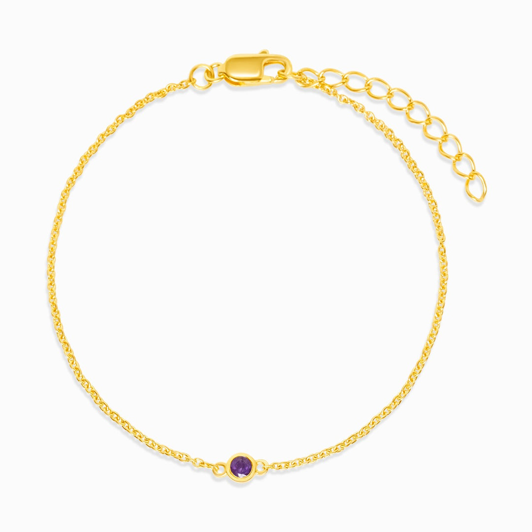 Pulsera de oro con Amatista morada que es la piedra de nacimiento de febrero. Joya con cristal de Amatista para llevar como pulsera en oro.