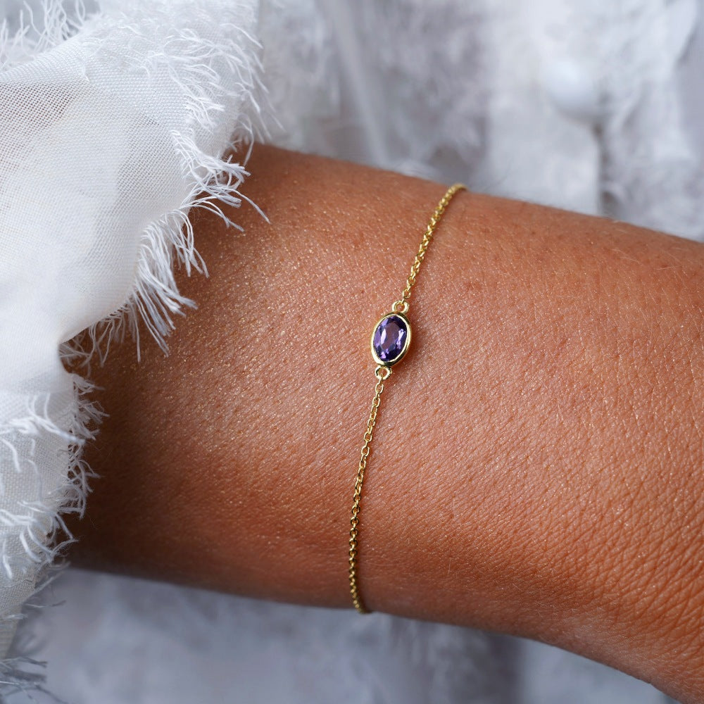 Pulsera con piedra natal de febrero Amatista. Pulsera de oro con cristal de Amatista violeta.